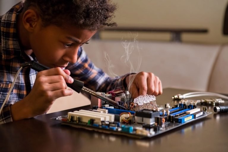 National Public School, Varthur Afro boy fixing motherboard.